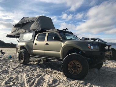 lifted truck on sand